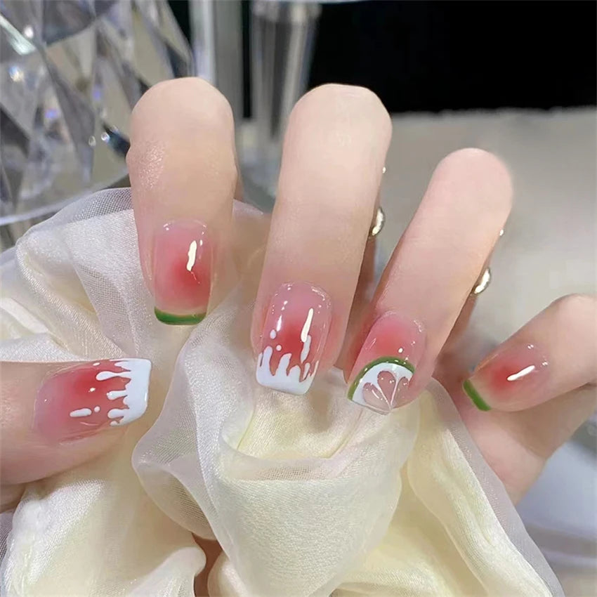 Decorated nail designs shown on hands