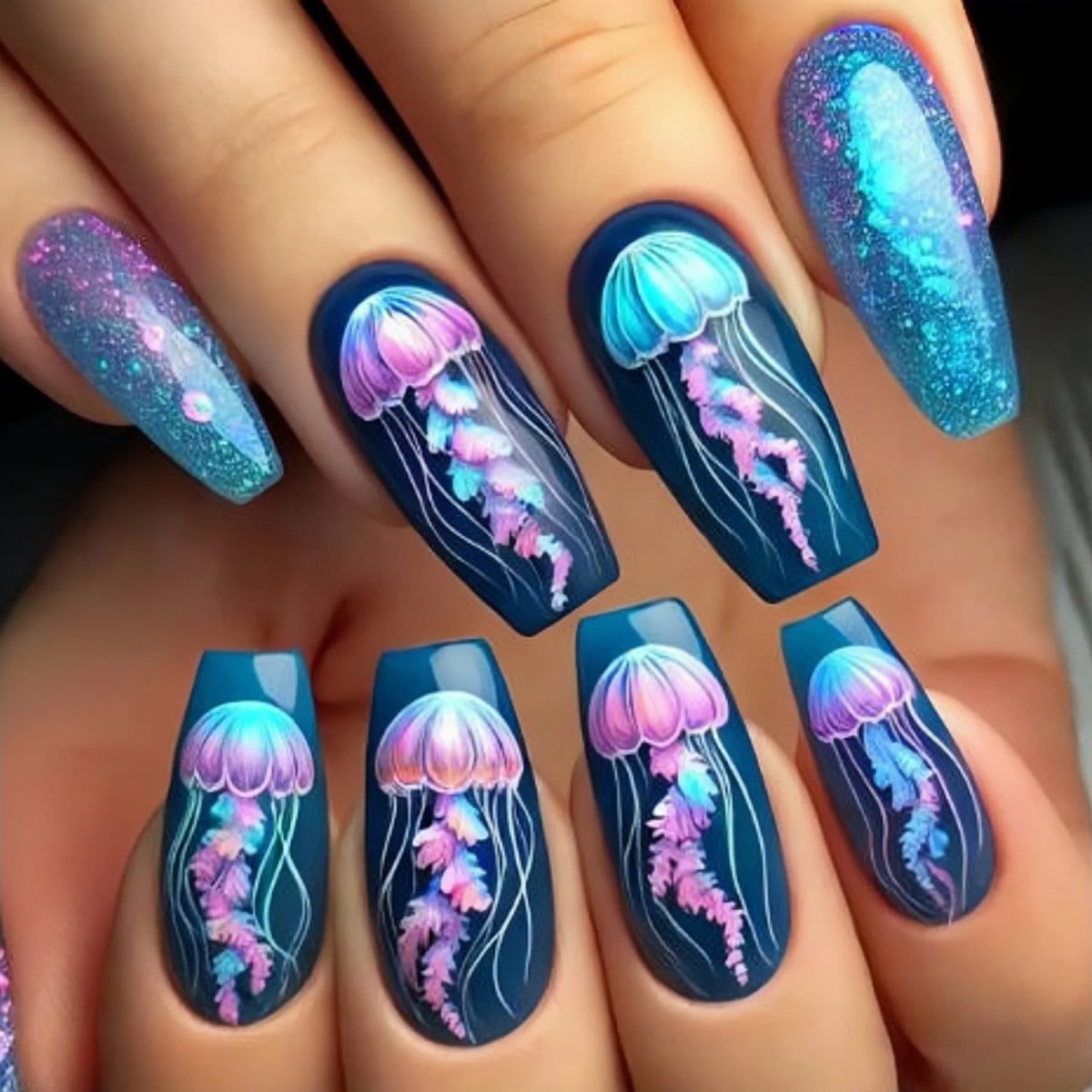 Colorful marine and summer-themed nail designs shown on hands