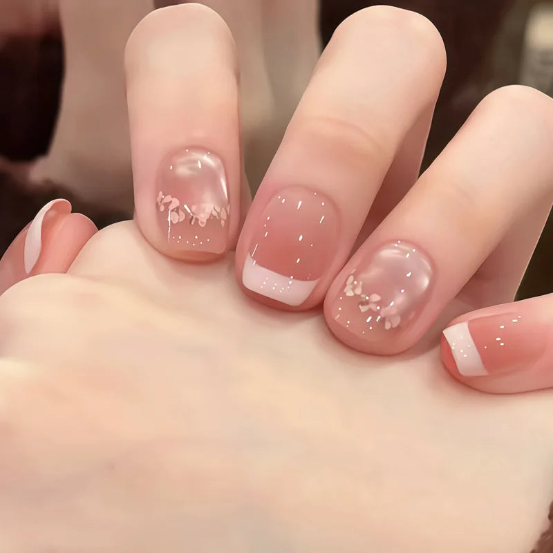 Decorated nail designs shown on hands