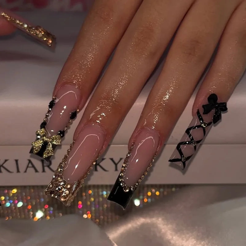 Decorative nail designs with floral, metallic or gem accents shown on hands