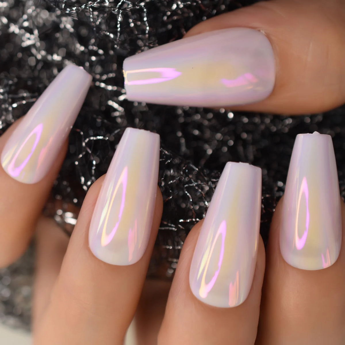 Chrome-finish nails shown on hands