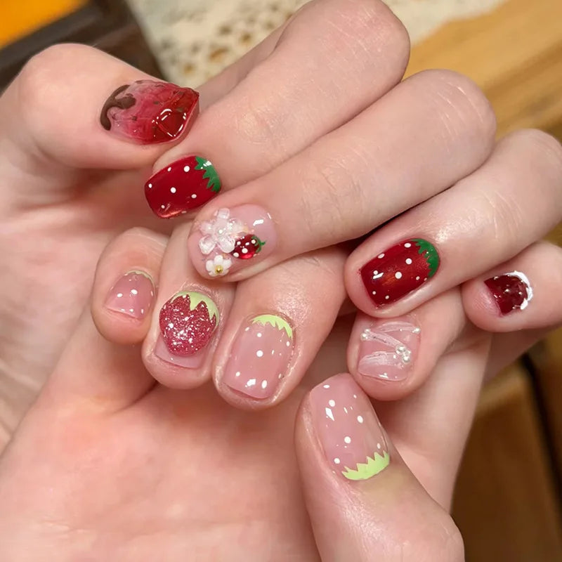 Decorated nail designs shown on hands