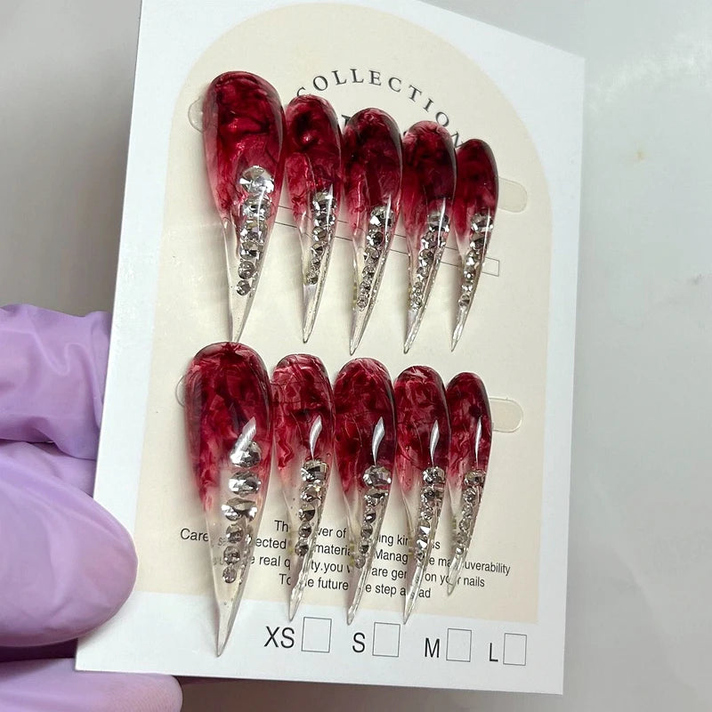 Decorated pointed press-on nails arranged in two rows