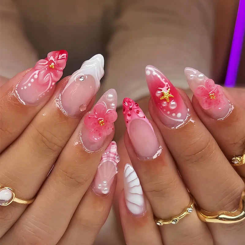 Decorated nail designs shown on hands