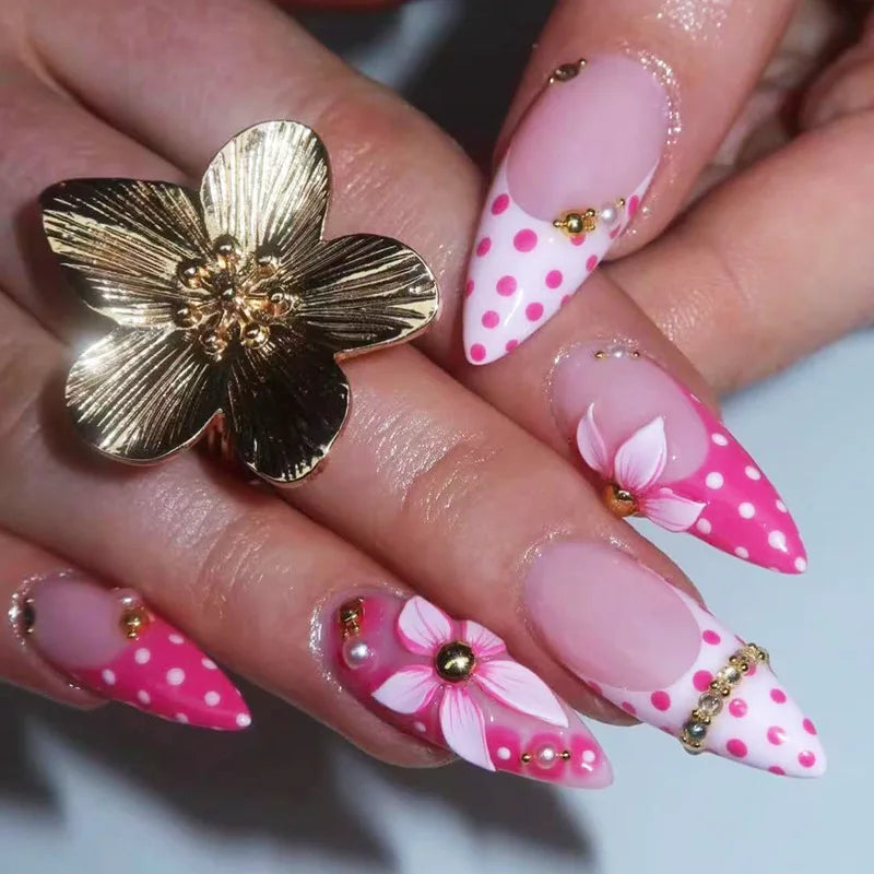 Long decorative nail designs with raised embellishments shown on hands