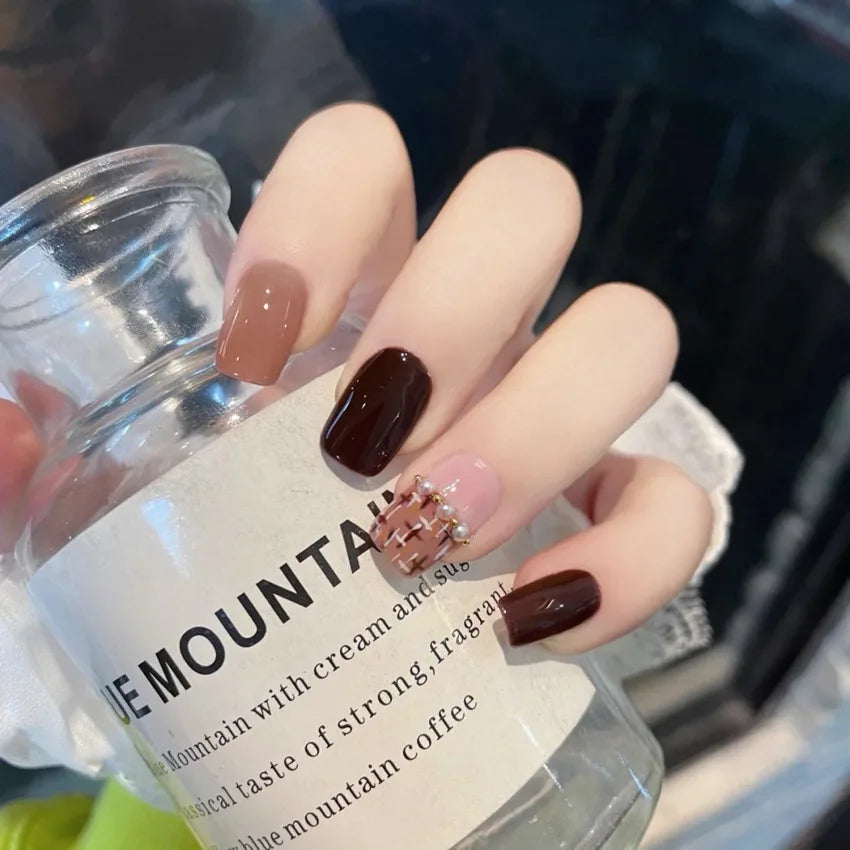 Decorated nail designs shown on hands