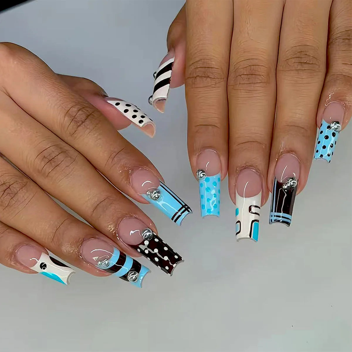 Decorated nail designs shown on hands