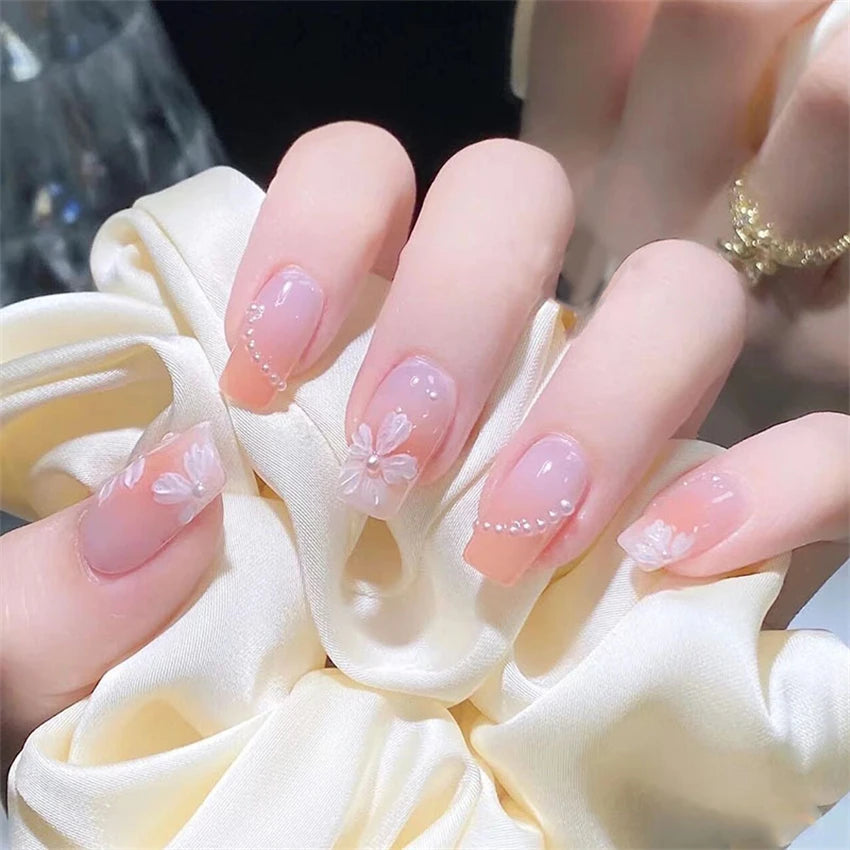 Decorated nail designs shown on hands
