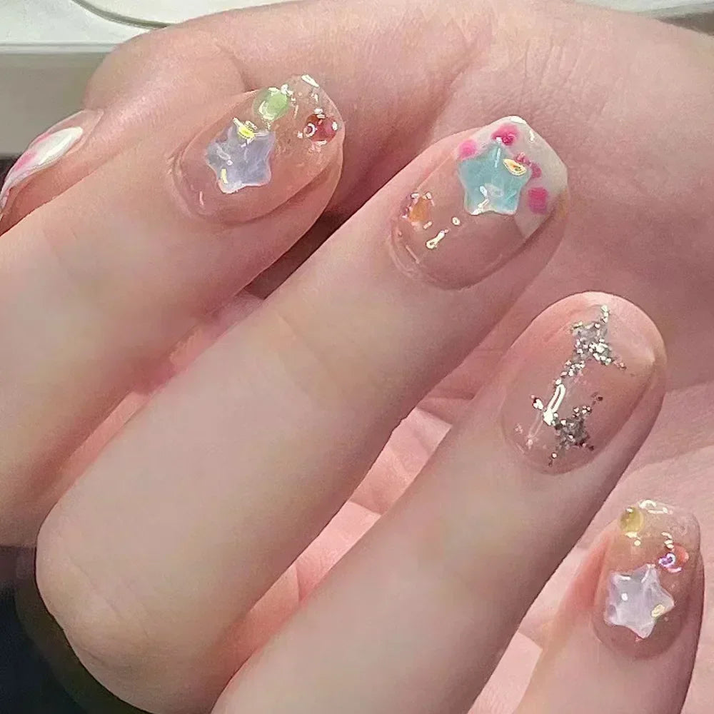 Decorated nail designs shown on hands