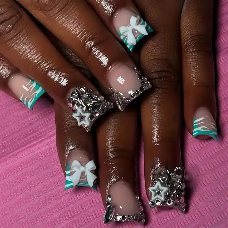 Decorative nail designs with raised accents shown on hands