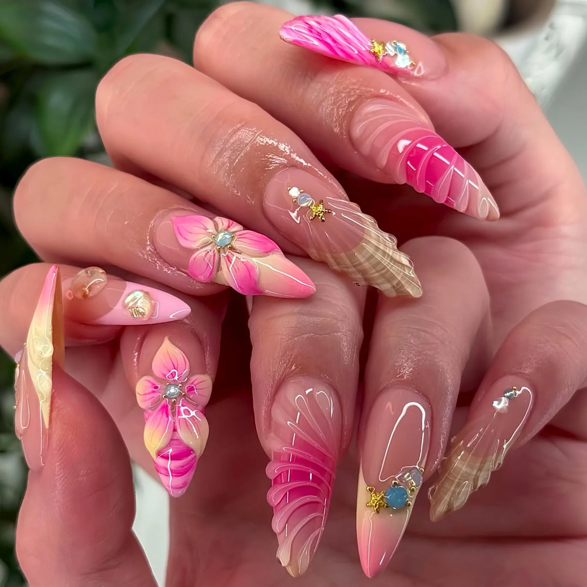 Decorative nail designs with raised accents shown on hands