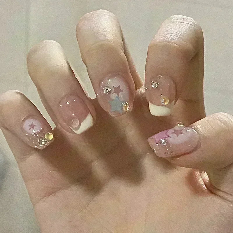 Decorated nail designs shown on hands