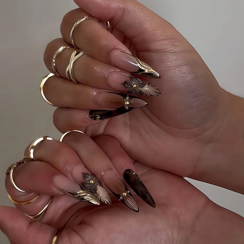 Metallic and embellished nails shown on hands