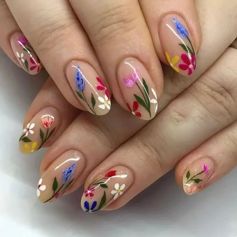 Colorful floral nails shown on hands