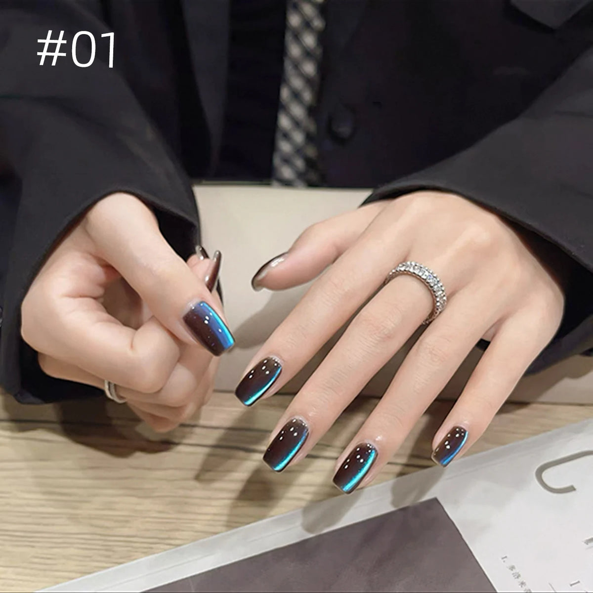 Numbered chrome nail shade shown on hands