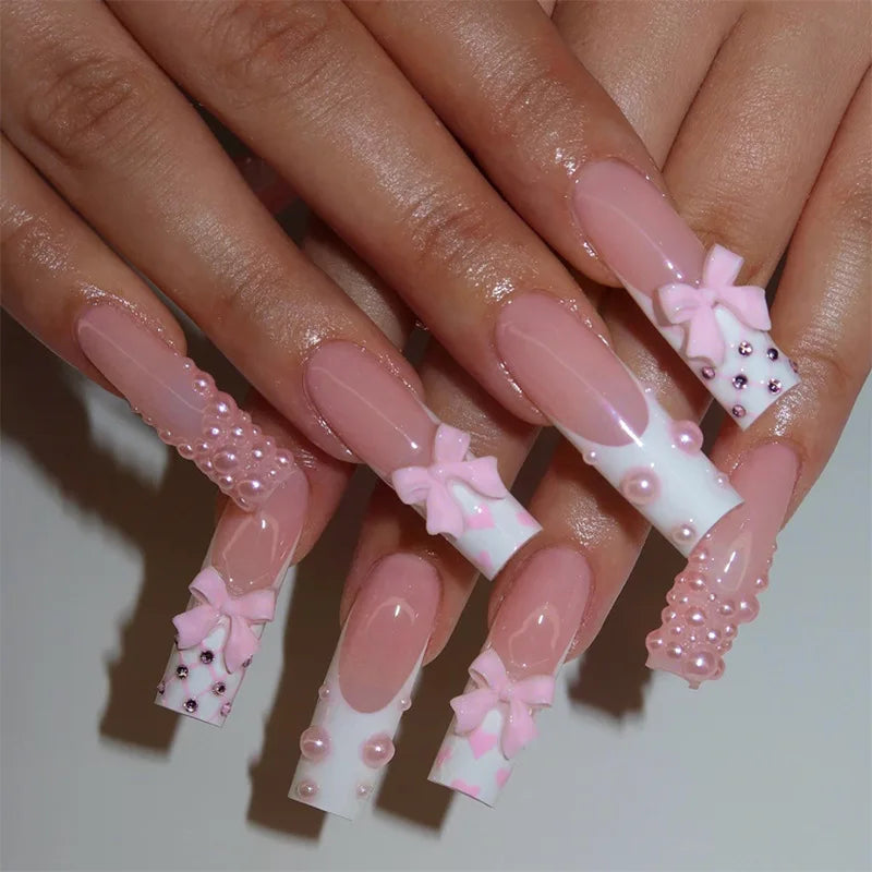 Decorated nail designs shown on hands