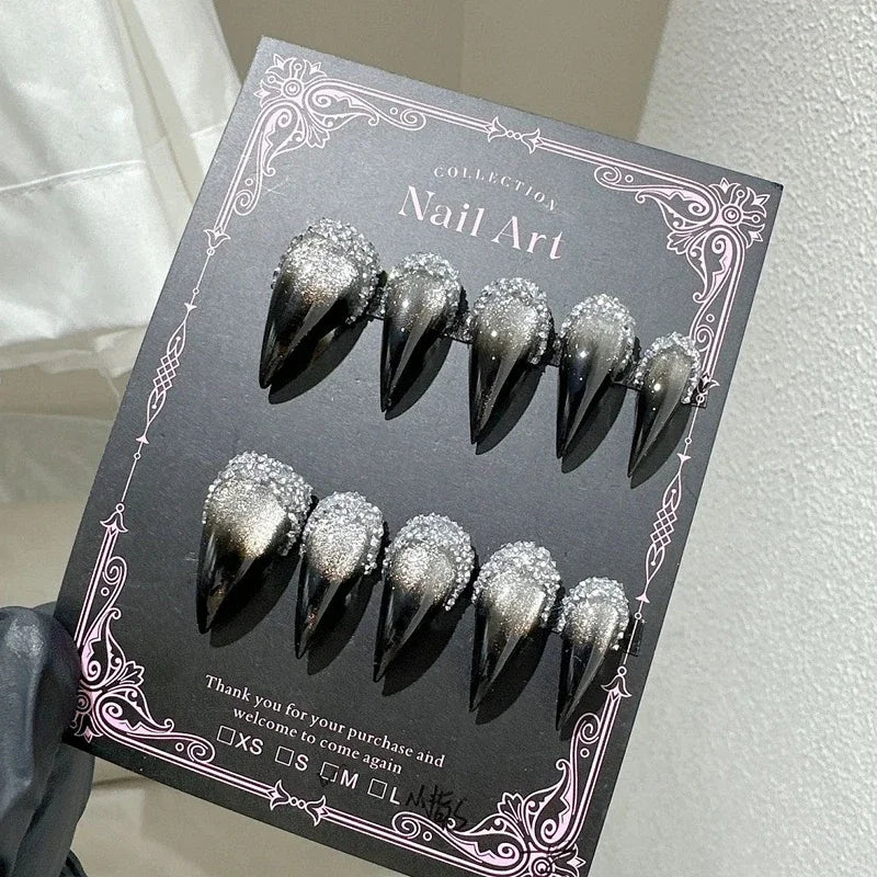 Decorated pointed press-on nails arranged in two rows