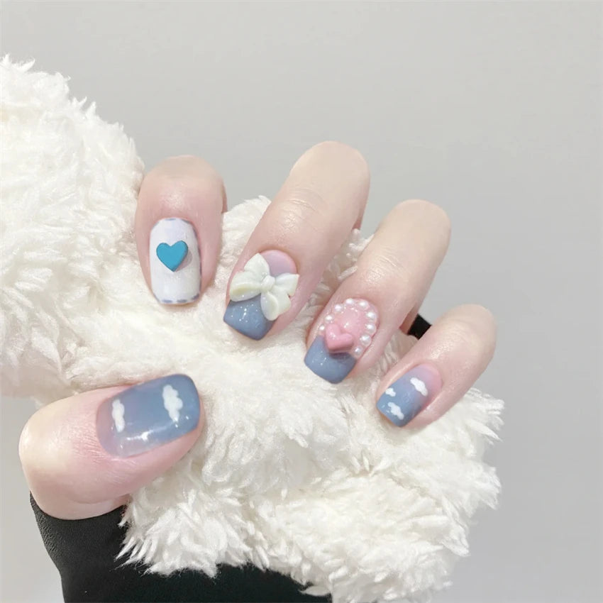 Decorated nail designs shown on hands