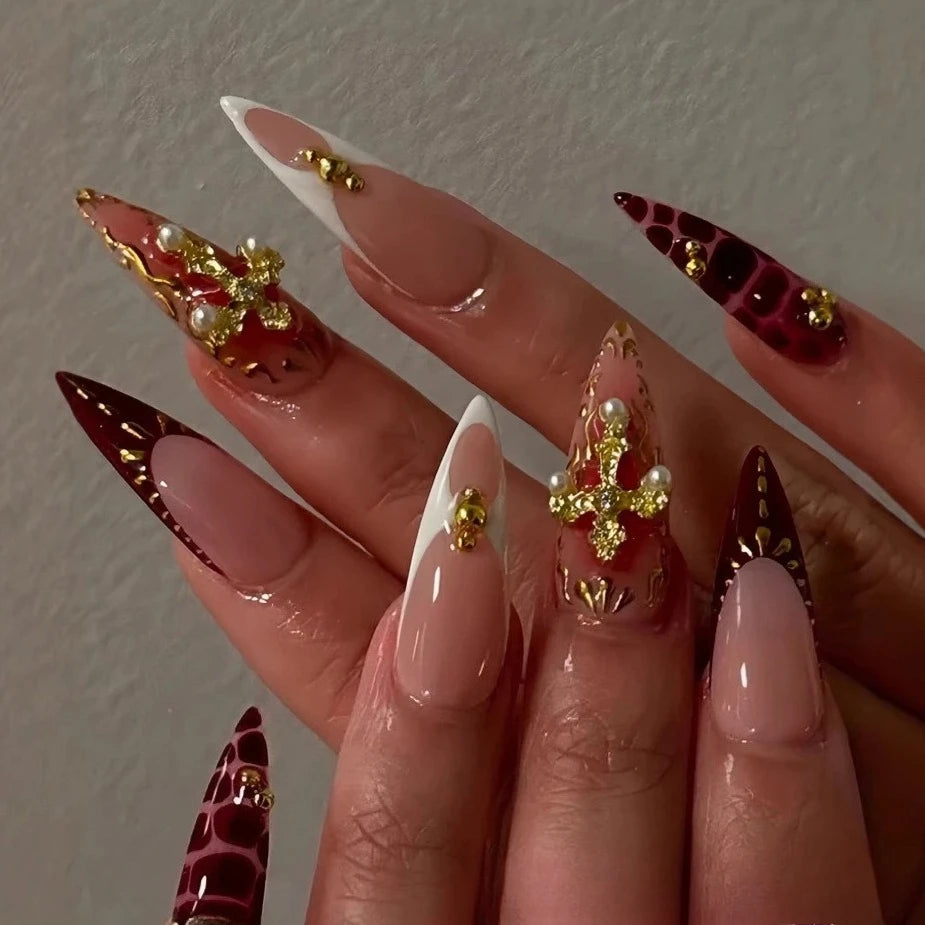 Metallic and embellished nails shown on hands