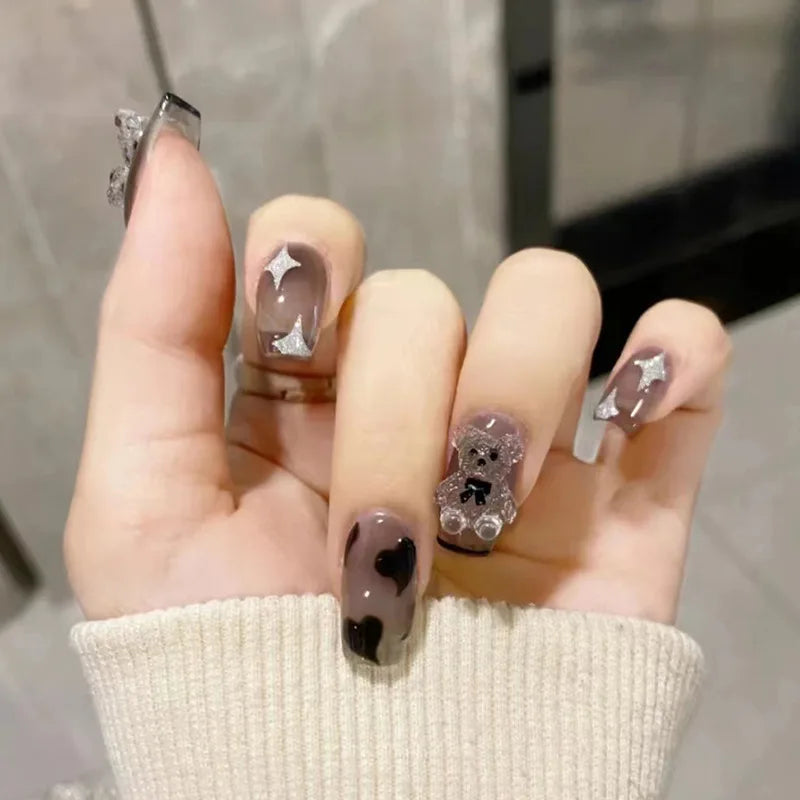Decorated nail designs shown on hands