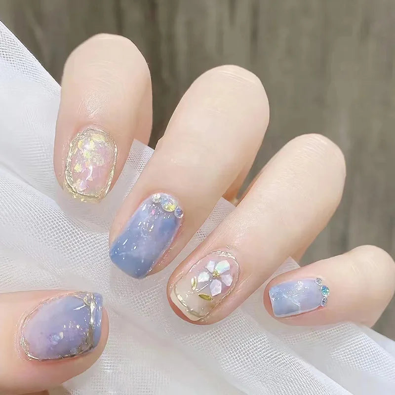 Decorated nail designs shown on hands