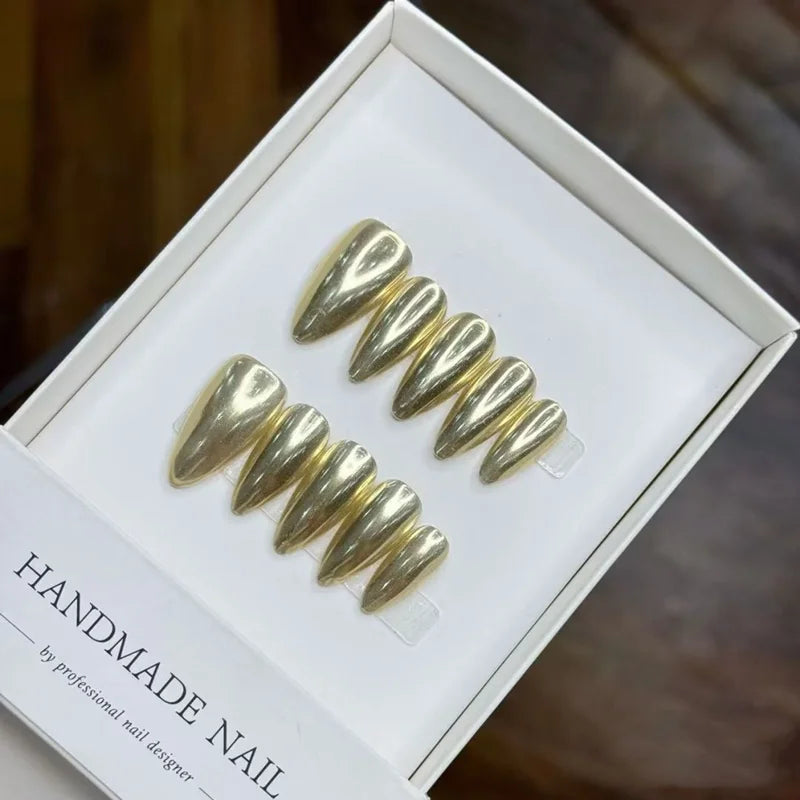 Gold metallic press-on nails in a box