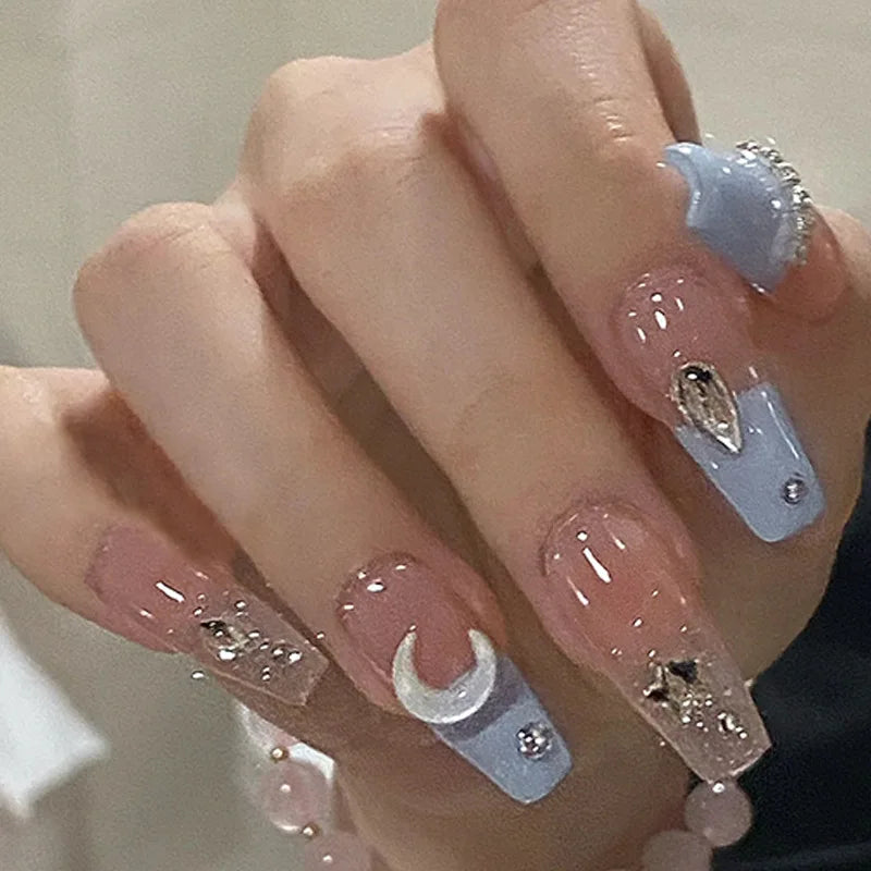 Decorated press-on nail designs shown on hands