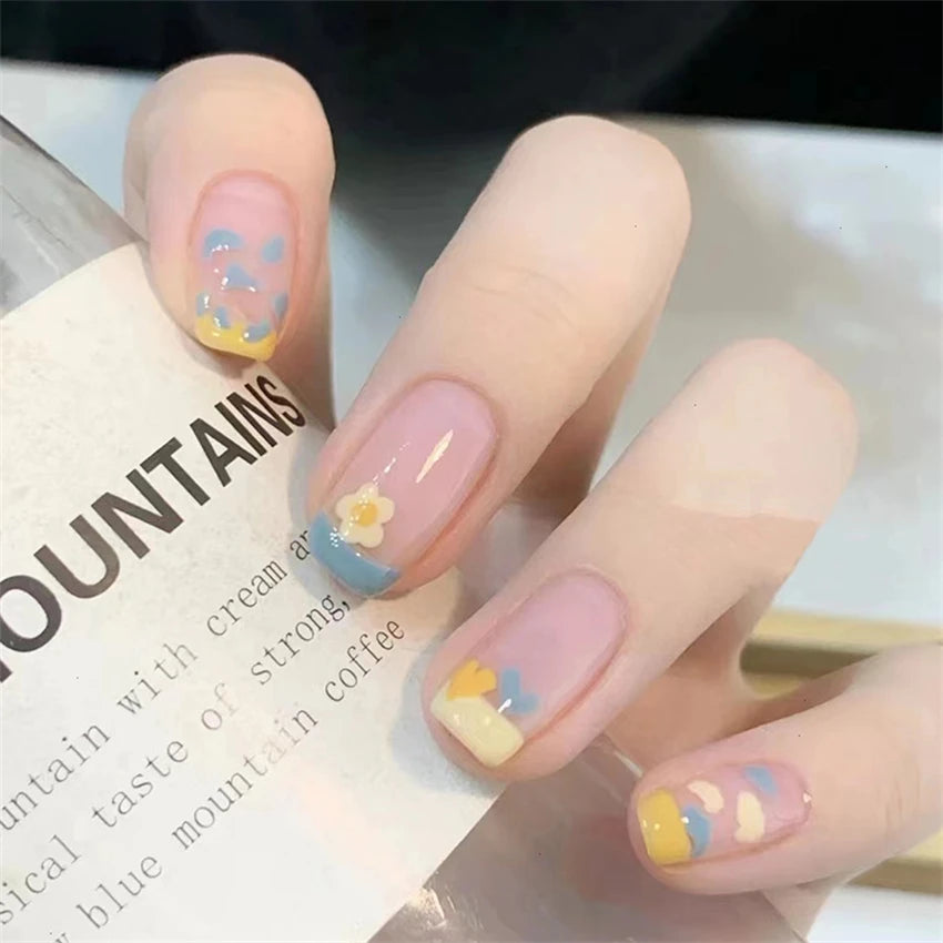 Decorated nail designs shown on hands