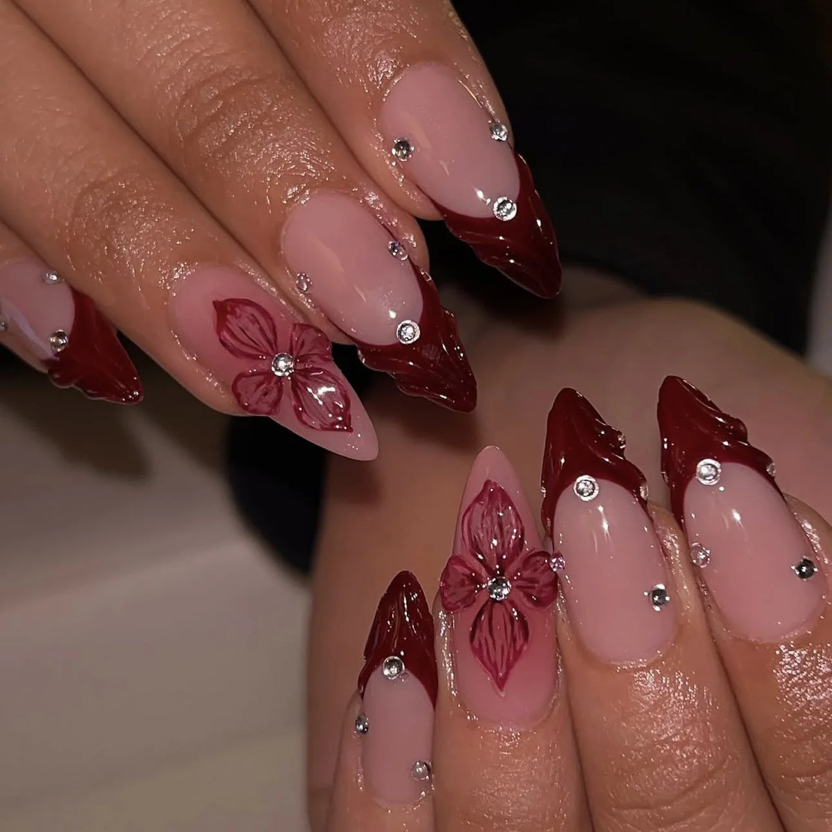 Decorated nail designs shown on hands