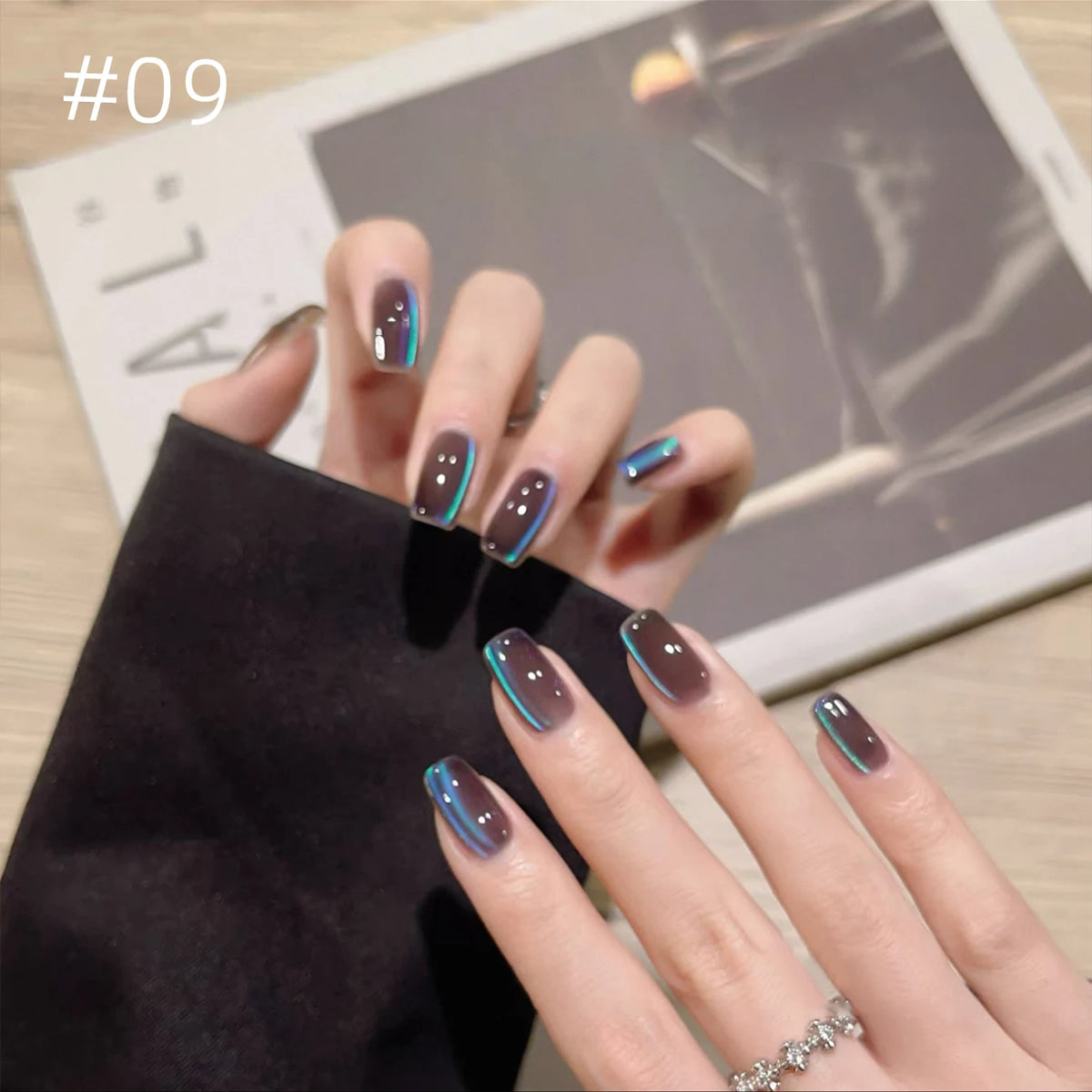 Numbered chrome nail shade shown on hands