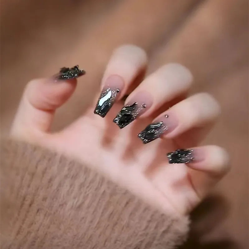 Decorated nail designs shown on hands