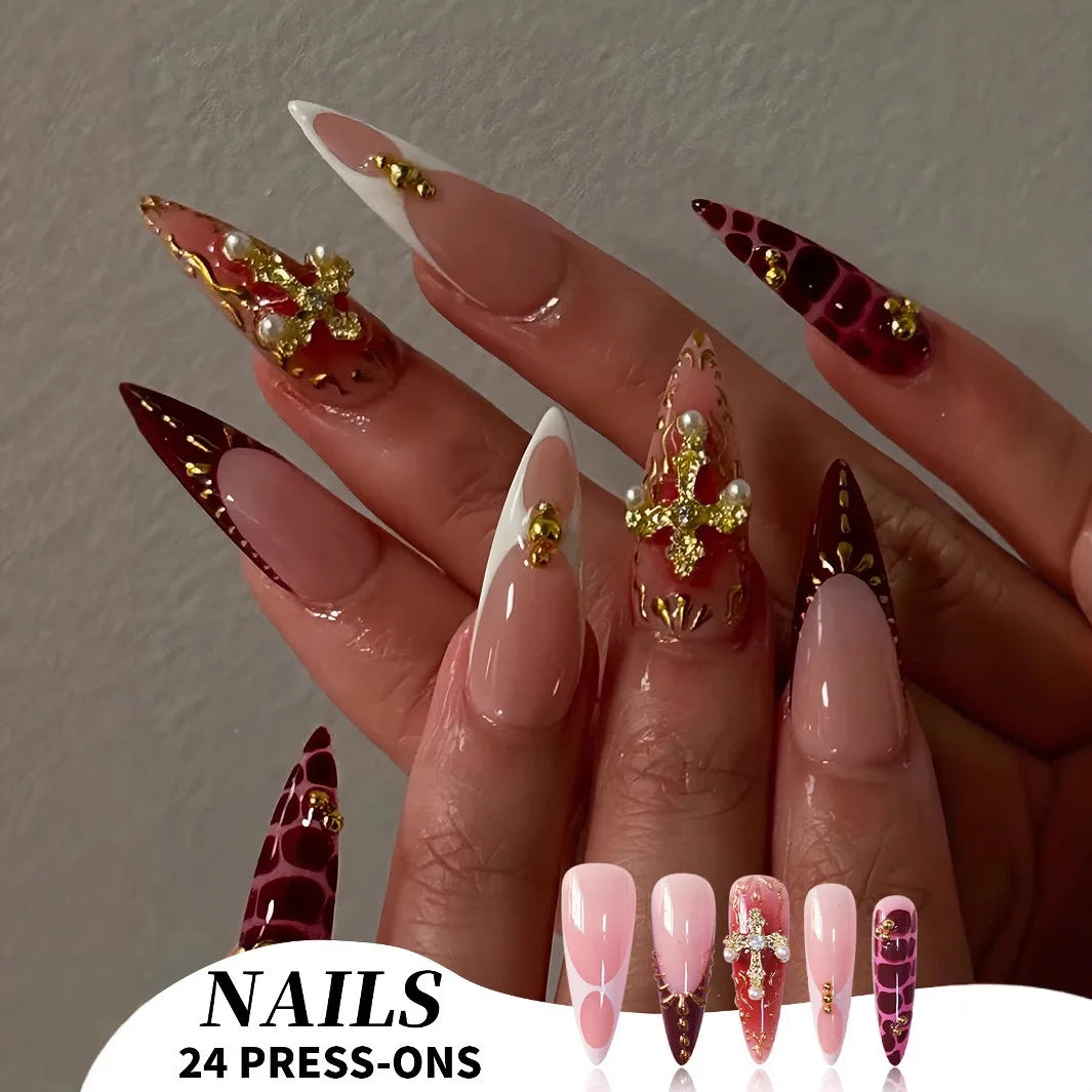 Long red embellished nails shown on hands