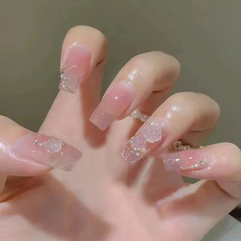 Decorated nail designs shown on hands