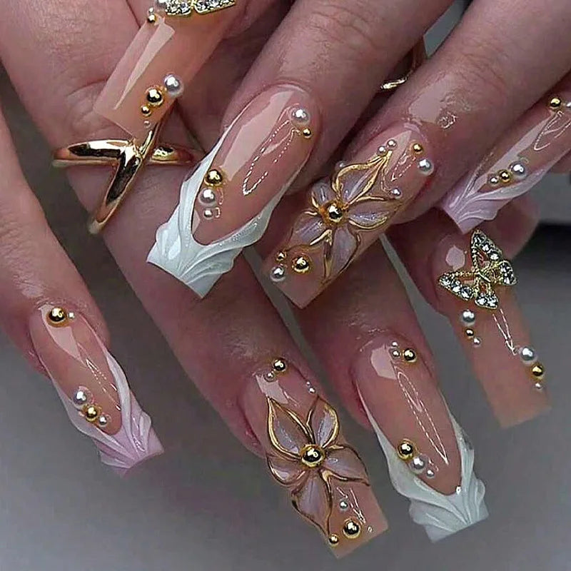 Decorated nail designs shown on hands