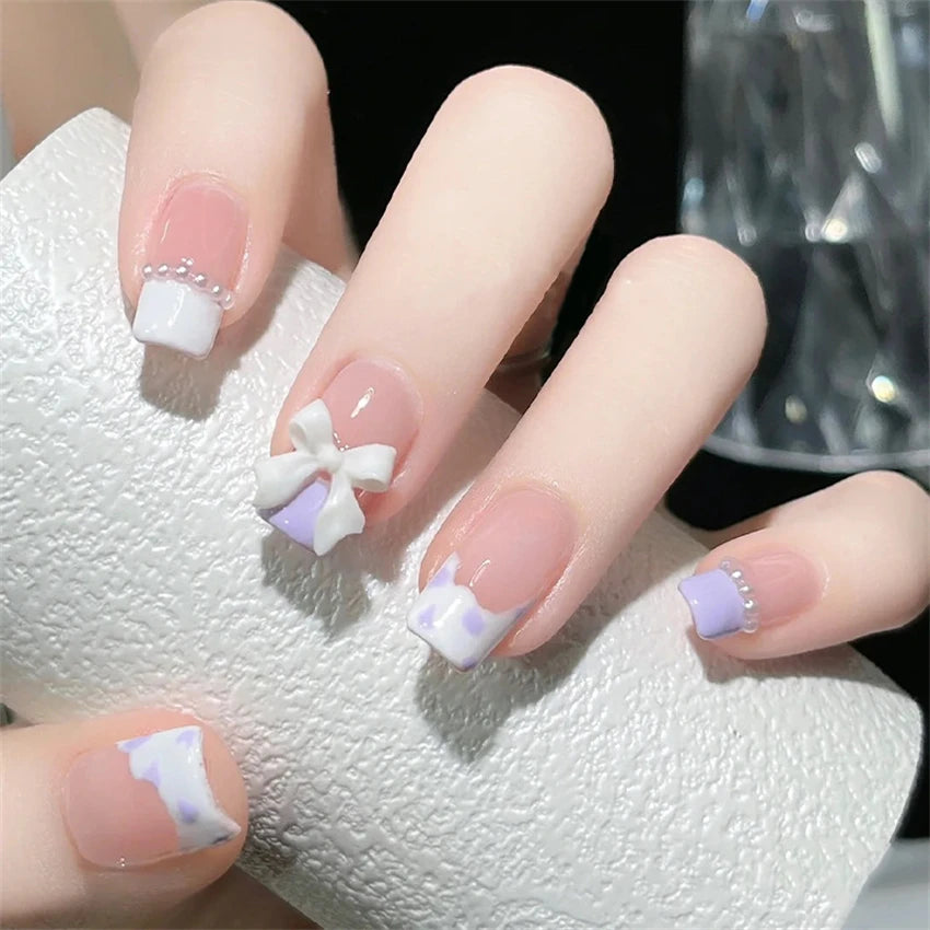 Decorated nail designs shown on hands