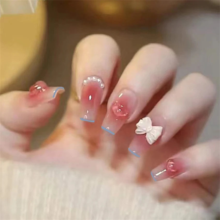 Decorated nail designs shown on hands