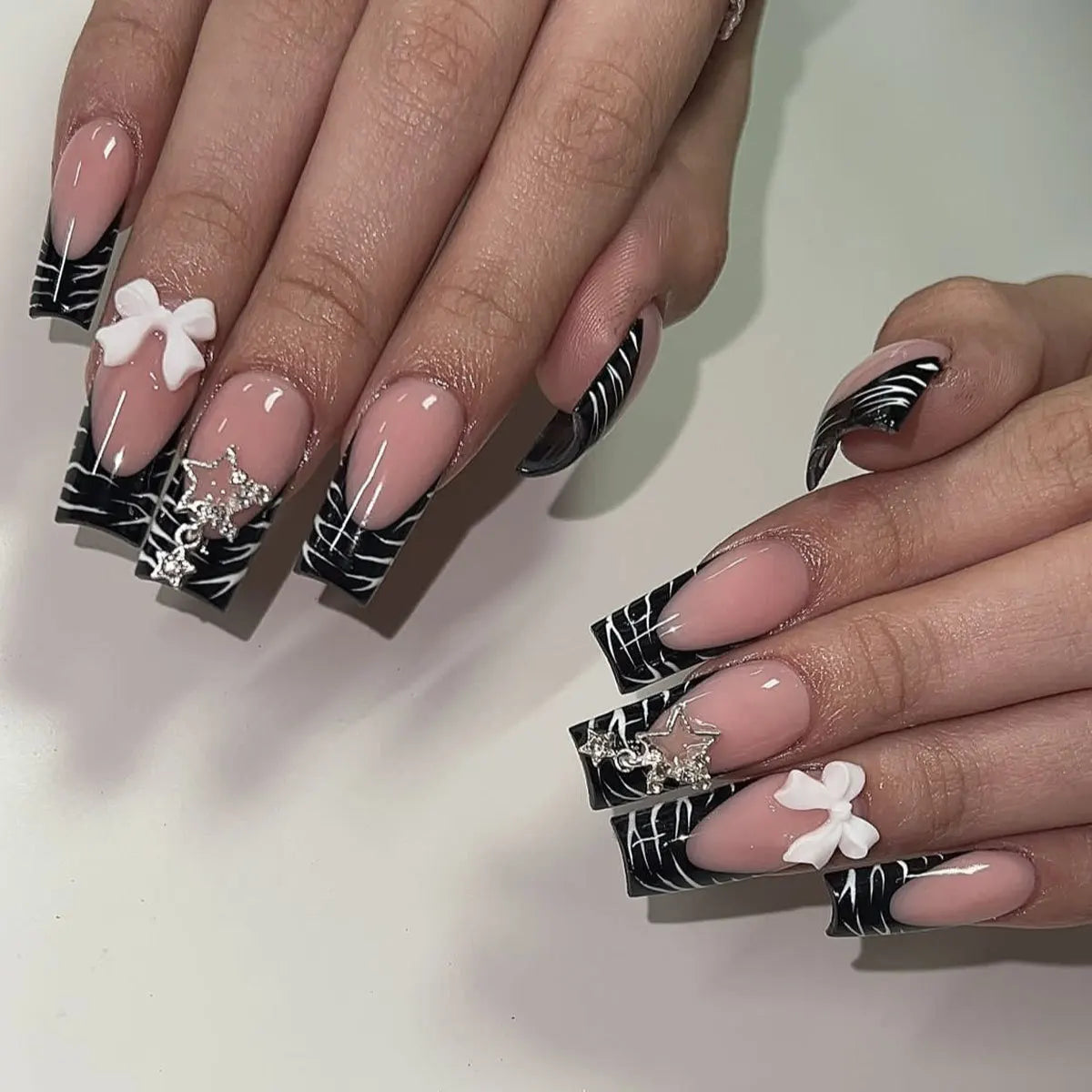Decorated nail designs shown on hands