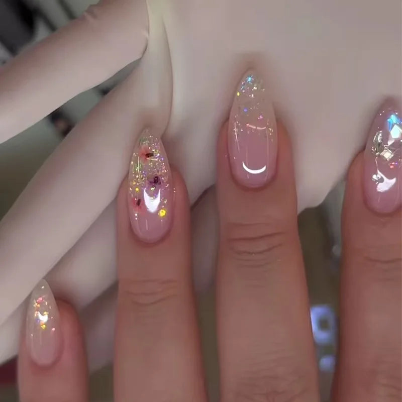 Decorated nail designs shown on hands