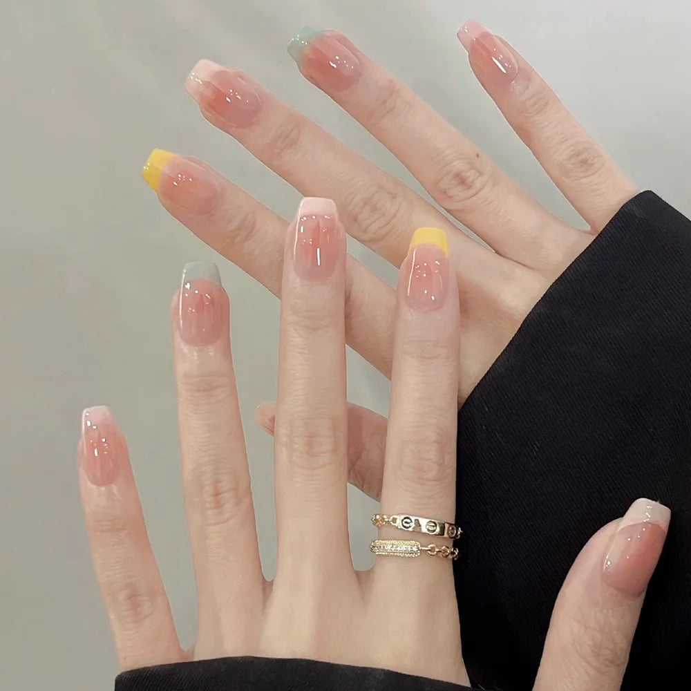 Decorated nail designs shown on hands