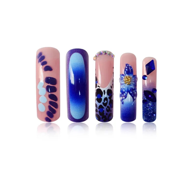 Decorated press-on nails arranged in rows