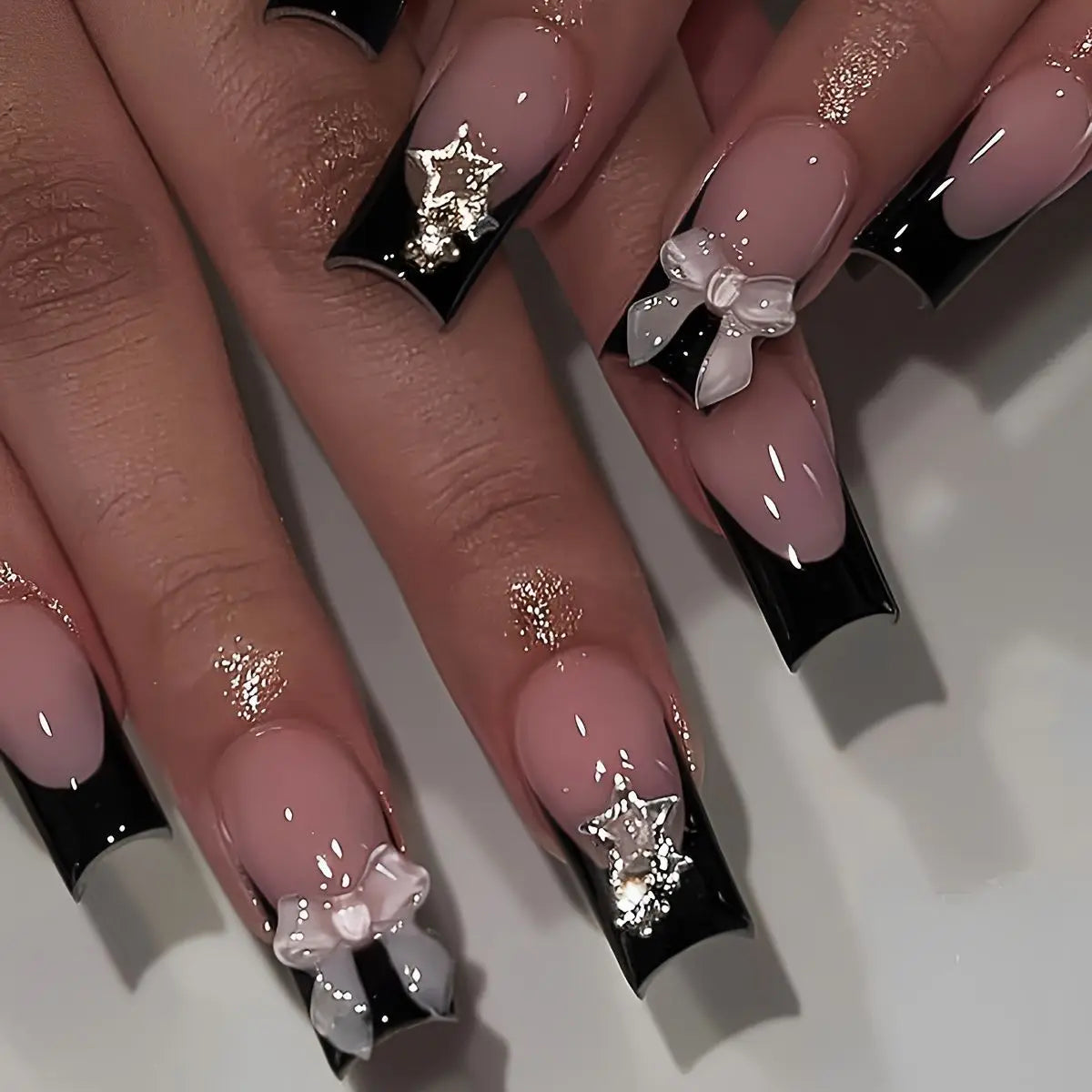 Decorated nail designs shown on hands