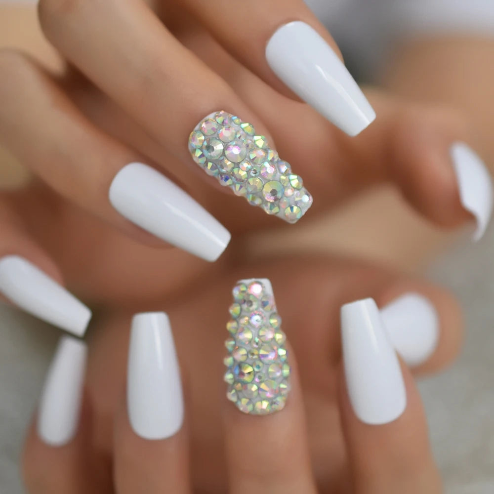 Rhinestone-decorated nail designs shown on hands