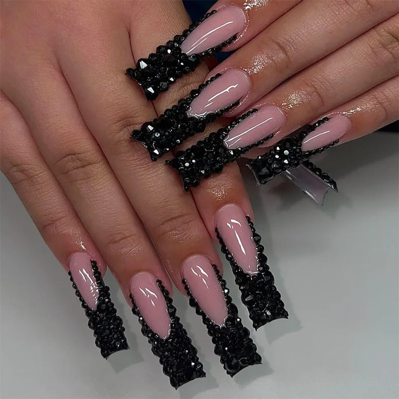 Long decorated nail designs shown on hands