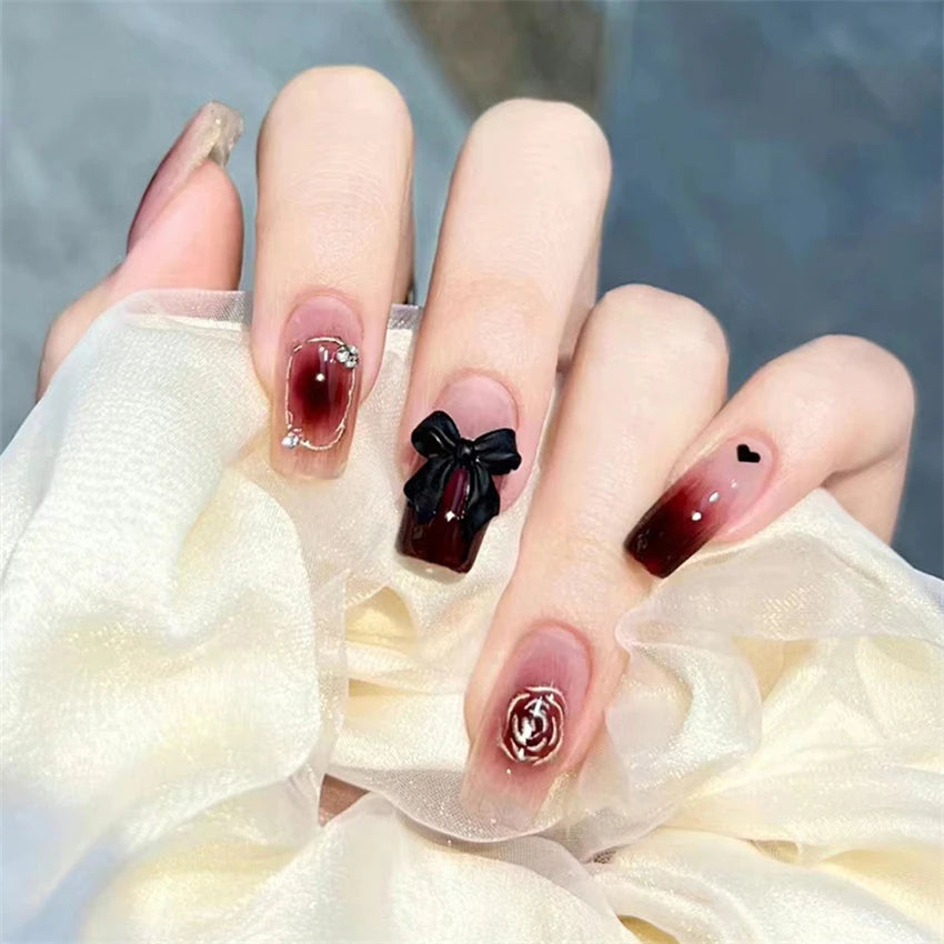 Decorated nail designs shown on hands