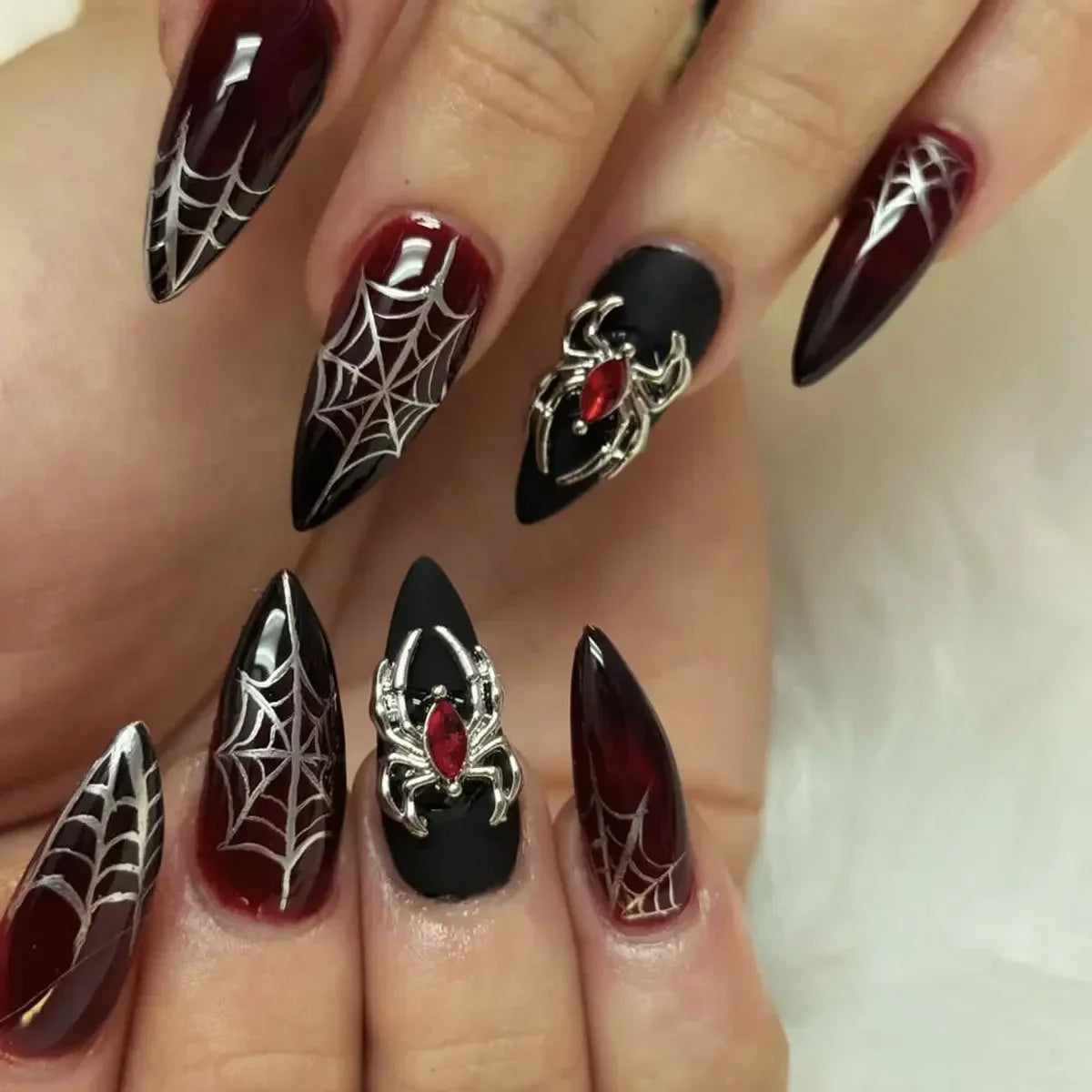 Long decorated nails shown on hands