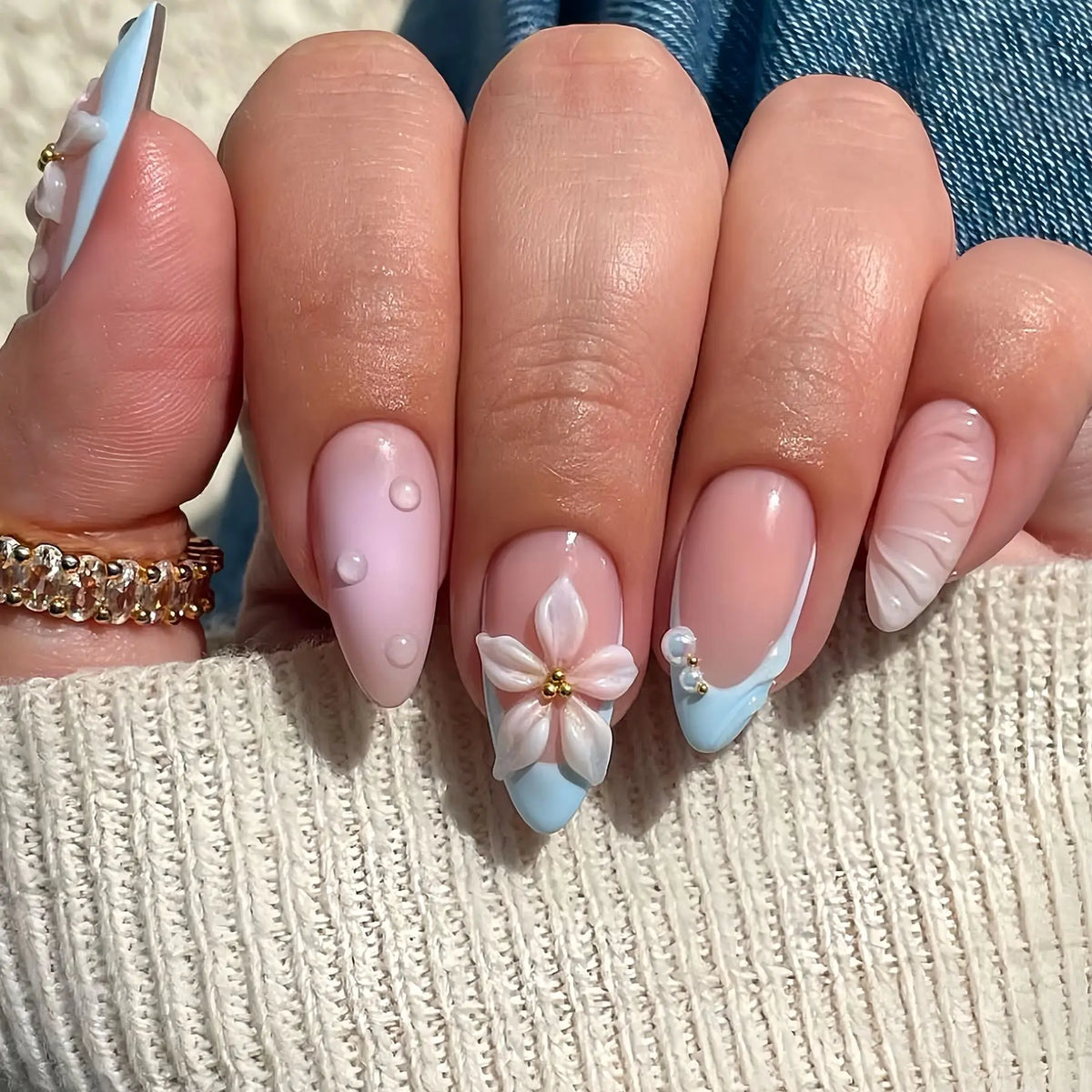Decorated nail designs shown on hands