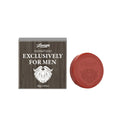 Round shaving soap bars beside their boxes