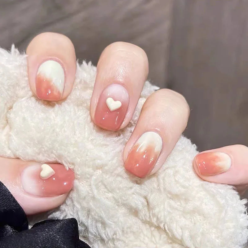 Decorated nail designs shown on hands