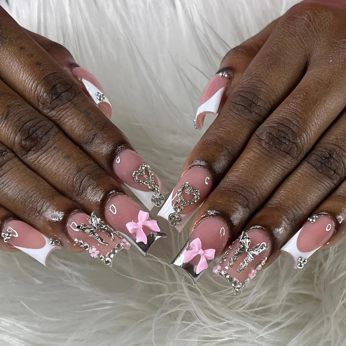 Decorated nail designs shown on hands