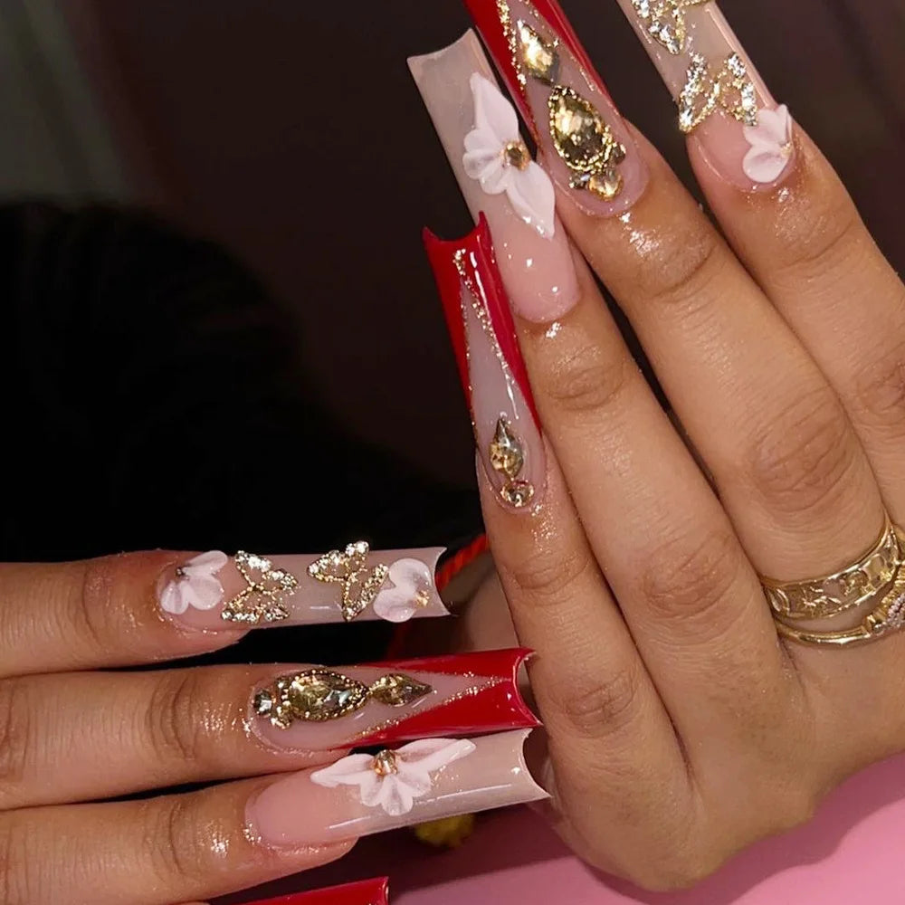Long decorated nail designs shown on hands